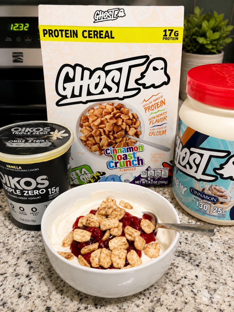 High protein cinnamon cereal bowl made with Ghost Cinnamon Toast Crunch protein cereal, Oikos Triple Zero yogurt, and Ghost Cinnabon protein powder